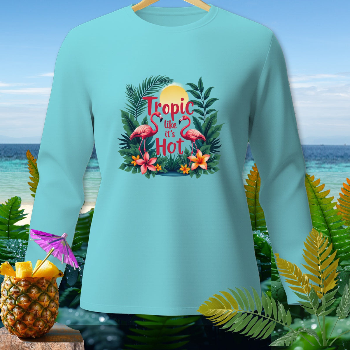 Light blue long-sleeve shirt with "Tropic like it's Hot" text and flamingos.
