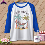 T-shirt graphic of a witch relaxing in a hammock between palm trees with text 