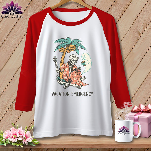 Skeleton, ghost, palm tree, and pumpkins graphic on a raglan t-shirt with "Vacation Emergency" text.