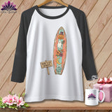 Raglan tee with a distressed surfboard graphic featuring a pumpkin, ghost, moon, and flowers.