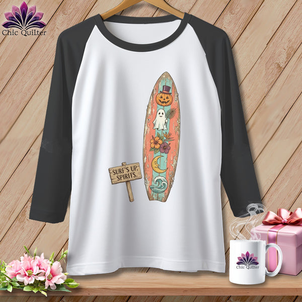 Raglan tee with a distressed surfboard graphic featuring a pumpkin, ghost, moon, and flowers.