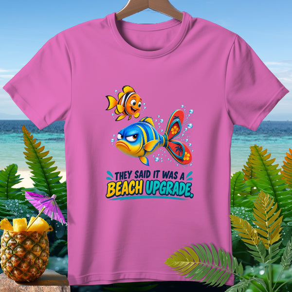 Pink t-shirt with cartoon fish and text "They Said It Was a Beach Upgrade."
