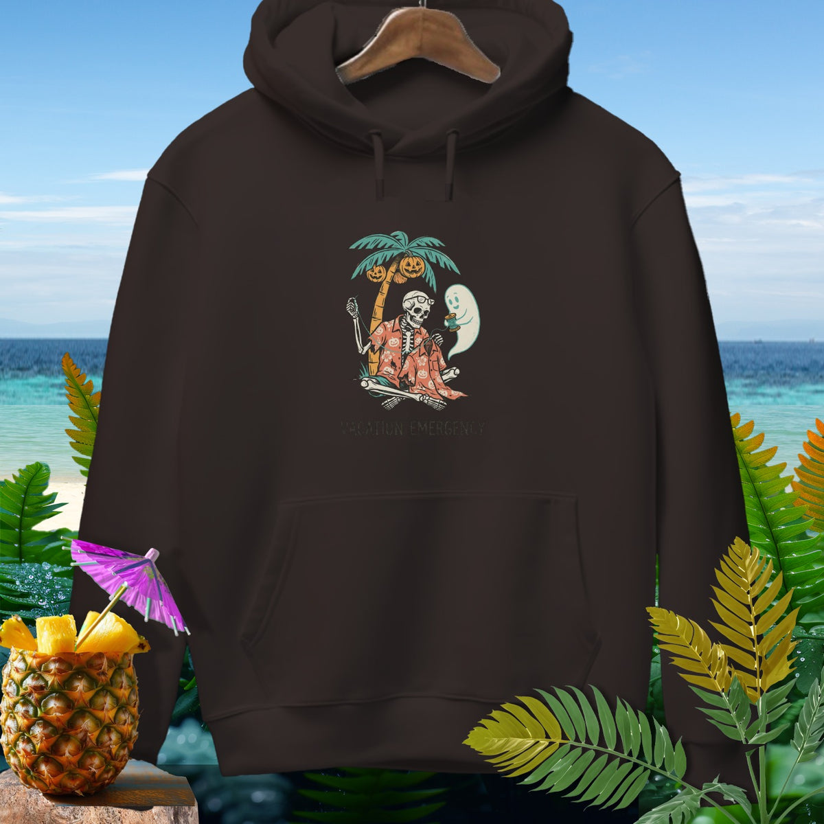 Brown hoodie with skeleton, ghost, palm tree, and pumpkins design.