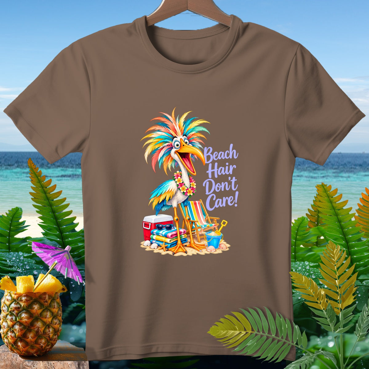 Brown t-shirt with a colorful bird on a beach with text "Beach Hair Don't Care!".
