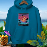 Teal hoodie with a sunset beach graphic featuring a jack-o'-lantern.
