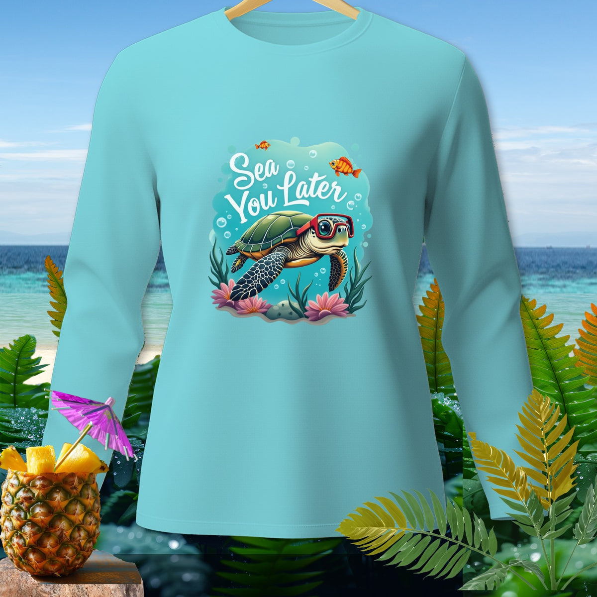 Light blue long-sleeve shirt with a cartoon turtle and text "Sea You Later".
