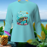 Light blue long-sleeve shirt with a cartoon turtle and text 