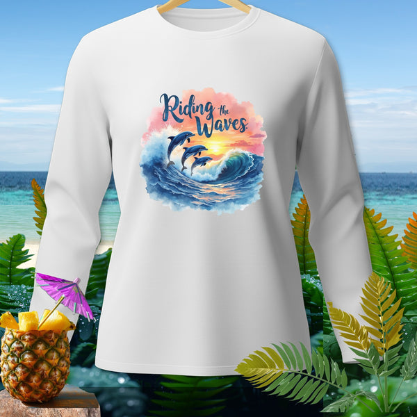 White long-sleeved shirt with dolphins riding a wave and the text "Riding the Waves".