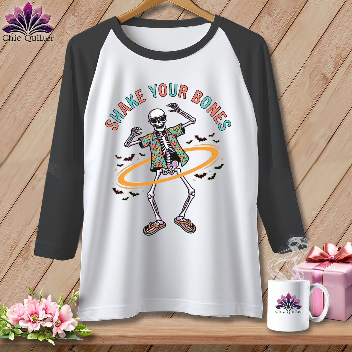 Baseball tee with dancing skeleton graphic and "Shake Your Bones" text.