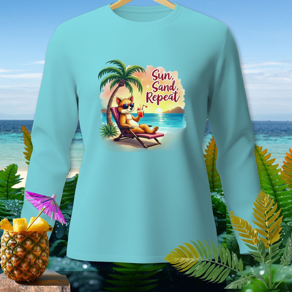 Light blue long-sleeve shirt with cartoon dog on beach and text "Sun, Sand, Repeat".