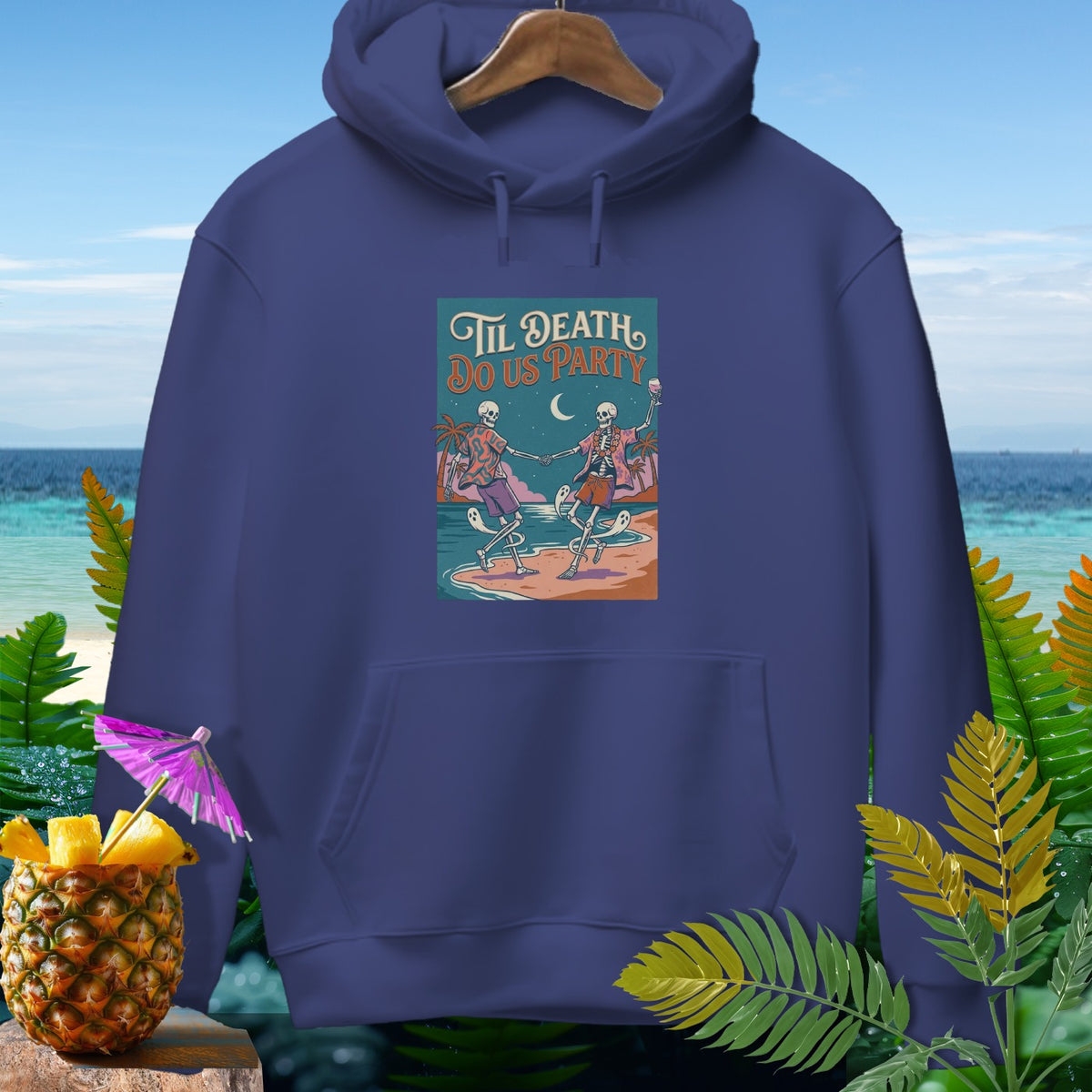 Navy hoodie with graphic of skeletons dancing on a beach titled "Til Death Do Us Party".