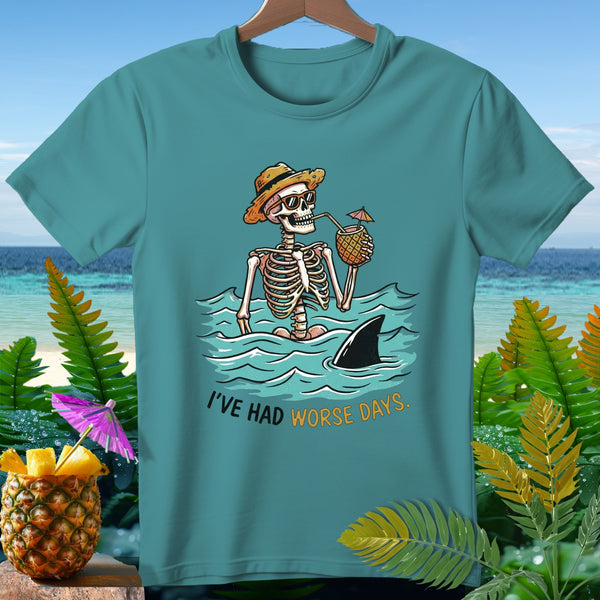 Skeleton in water with pineapple drink, shark fin, and text "I'VE HAD WORSE DAYS."