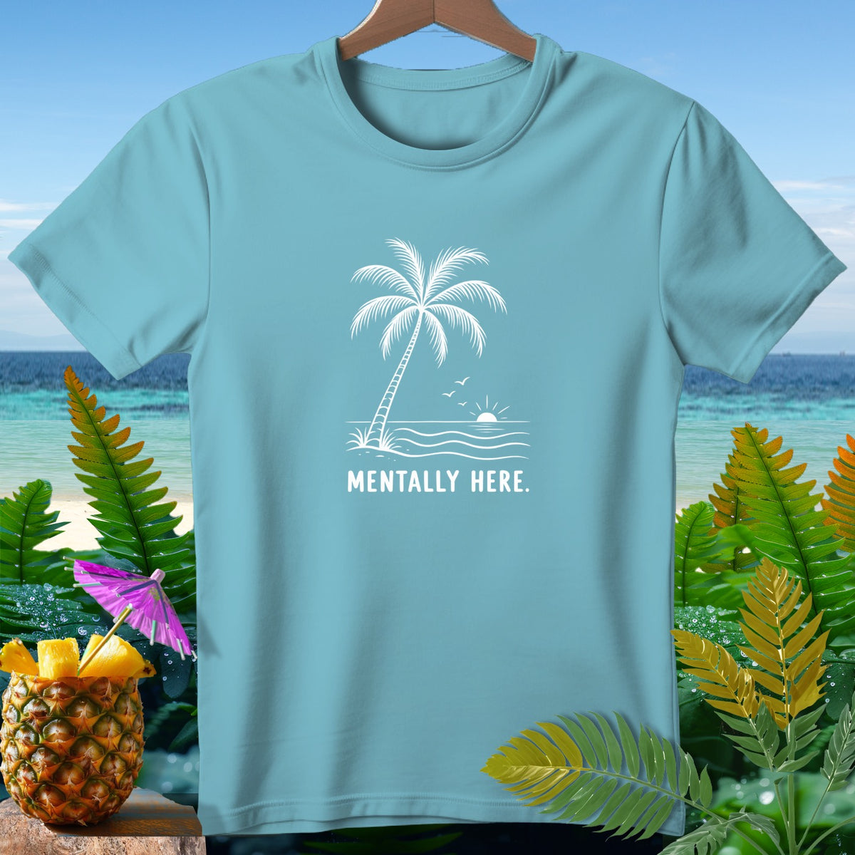 Light blue t-shirt with white graphic of palm tree, sun, and waves.
