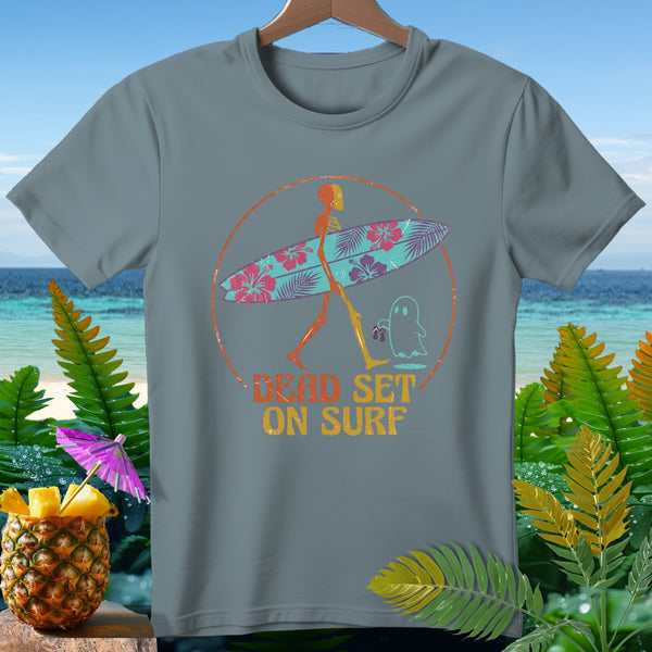 Skeleton carrying a surfboard with text "DEAD SET ON SURF".