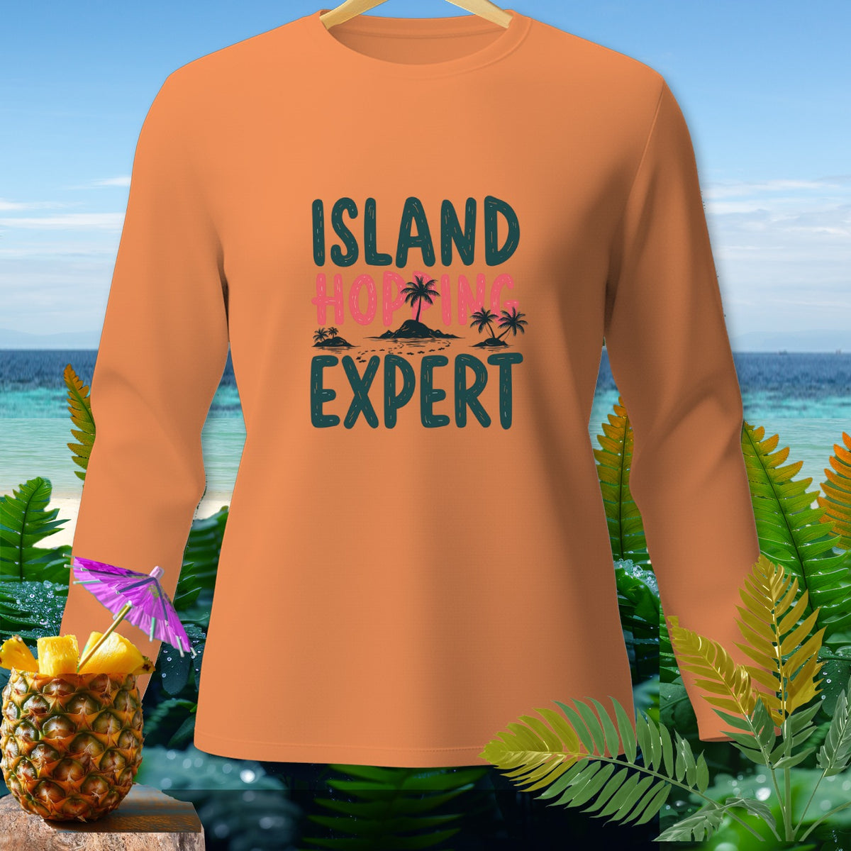 Orange long sleeve shirt with "ISLAND HOPPING EXPERT" text and tropical graphics.