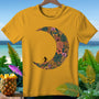 Yellow t-shirt with a crescent moon design filled with tropical leaves and flowers, featuring a surfer silhouette.