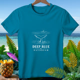 Teal t-shirt with white whale tail and text 