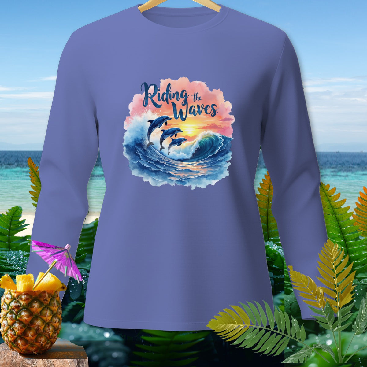 Long sleeve purple shirt with dolphins riding waves graphic and "Riding the Waves" text.