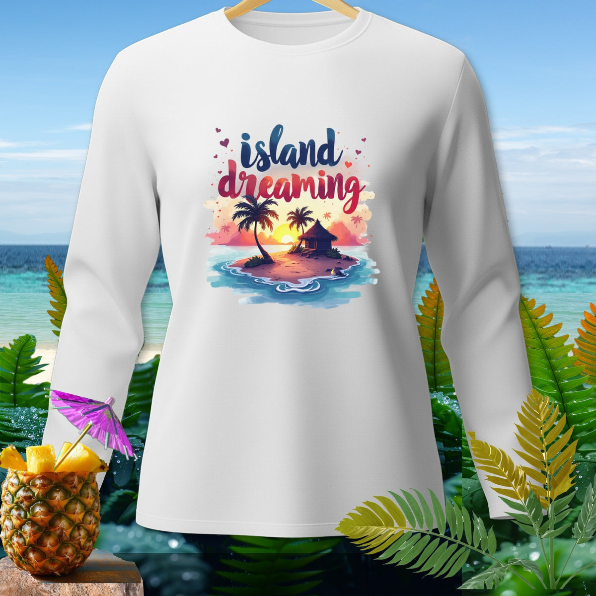 White long-sleeve shirt with "island dreaming" text and tropical island graphic.