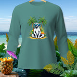Teal long-sleeve shirt with a polar bear in sunglasses on a beach between palm trees.