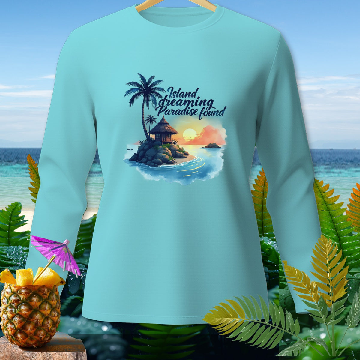 Light blue long-sleeved shirt with "Island dreaming Paradise found" text and tropical island graphic.