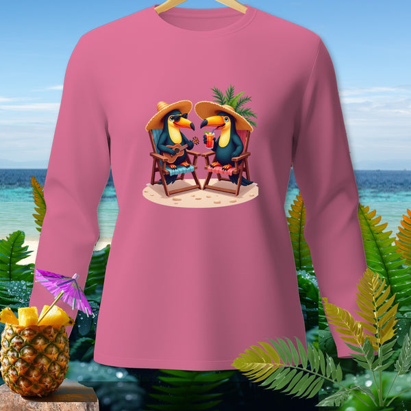 Pink long-sleeve shirt with two toucans wearing straw hats on a beach.