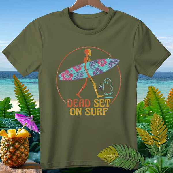 Skeleton carrying a hibiscus surfboard with ghost and text "Dead Set on Surf".