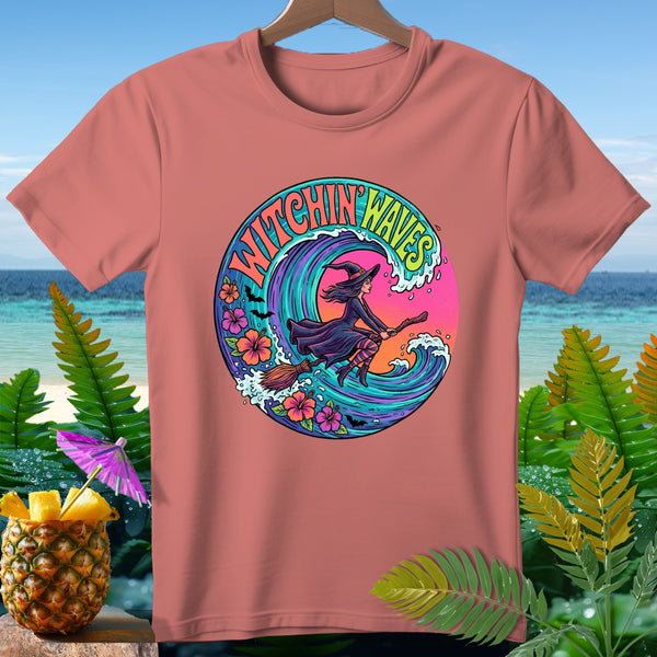 T-shirt with a circular graphic of a witch flying on a broom over a wave, text "Witchin' Waves".