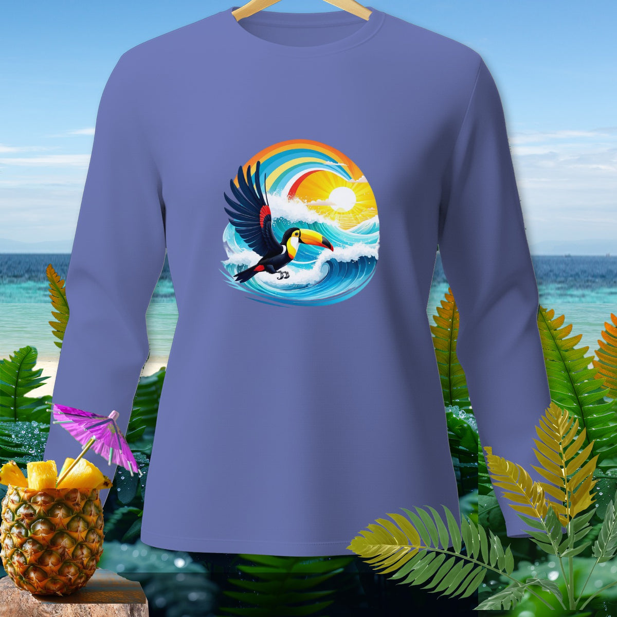 Long sleeve shirt with toucan, ocean waves, rainbow, and sun graphic.