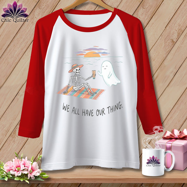 Skeleton and ghost on beach, with text "We all have our thing."