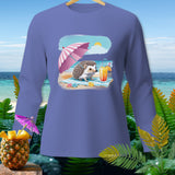 Long sleeve purple shirt with a cartoon hedgehog under a pink umbrella on a beach.