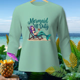 Mint green long-sleeve shirt with a mermaid graphic reading 