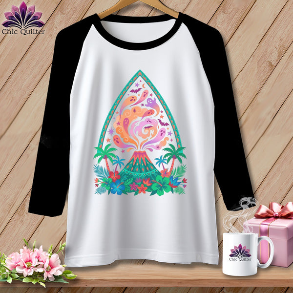 White raglan shirt with colorful volcano, ghosts, bats, and tropical foliage design.