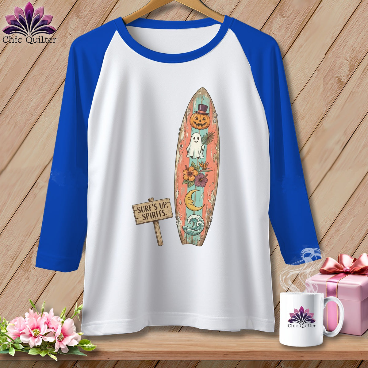 White t-shirt with blue sleeves, featuring a surfboard graphic with pumpkin, ghost, and moon.