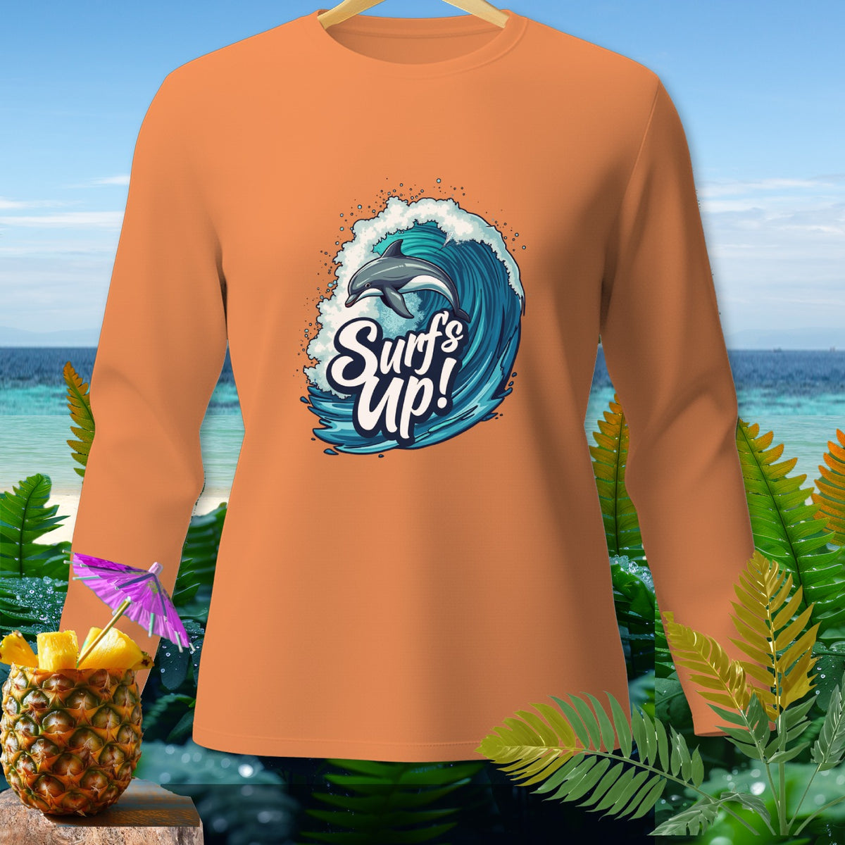Orange long-sleeved shirt with a dolphin jumping over a wave and "Surf's Up!" text.