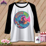 White t-shirt with black sleeves featuring a witch riding a broom over waves.