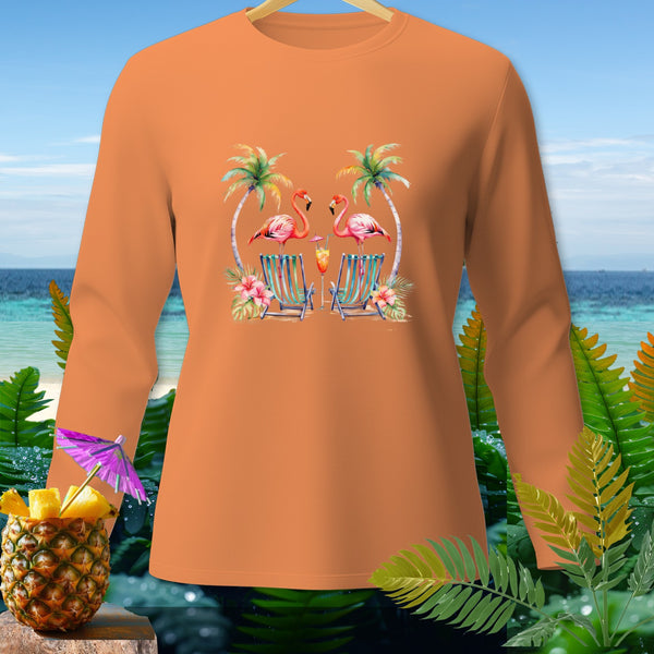 Orange long-sleeve shirt with two flamingos on beach chairs and palm trees graphic.
