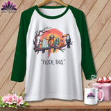 Green and white t-shirt with cartoon birds in Halloween costumes and text 