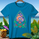 Teal t-shirt with a colorful volcano, ghosts, palm trees, and floral design.