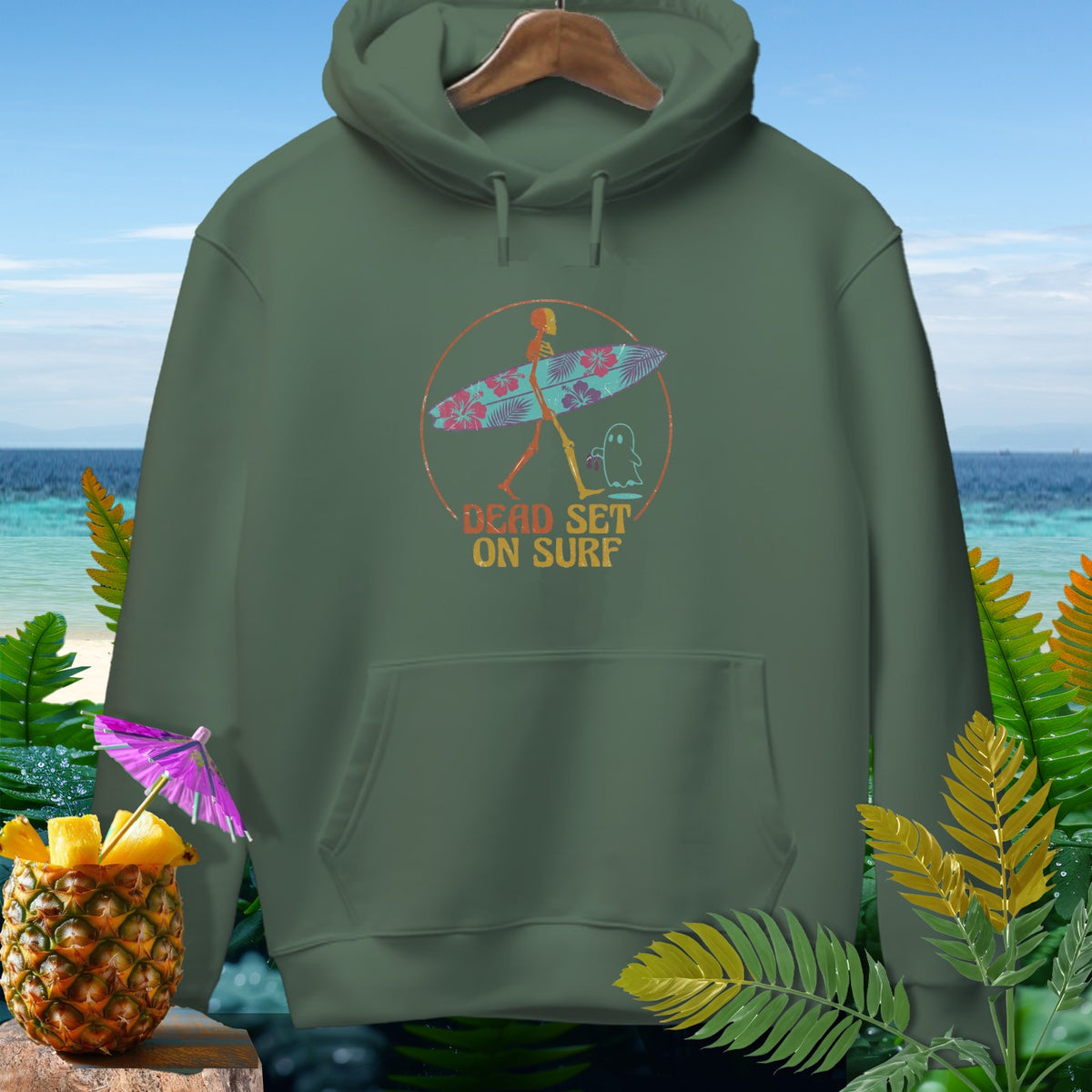 Green hoodie with a skeleton surfer graphic and "Dead Set On Surf" text.
