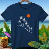 Navy t-shirt with white palm trees and sun graphic, surrounded by tropical foliage.