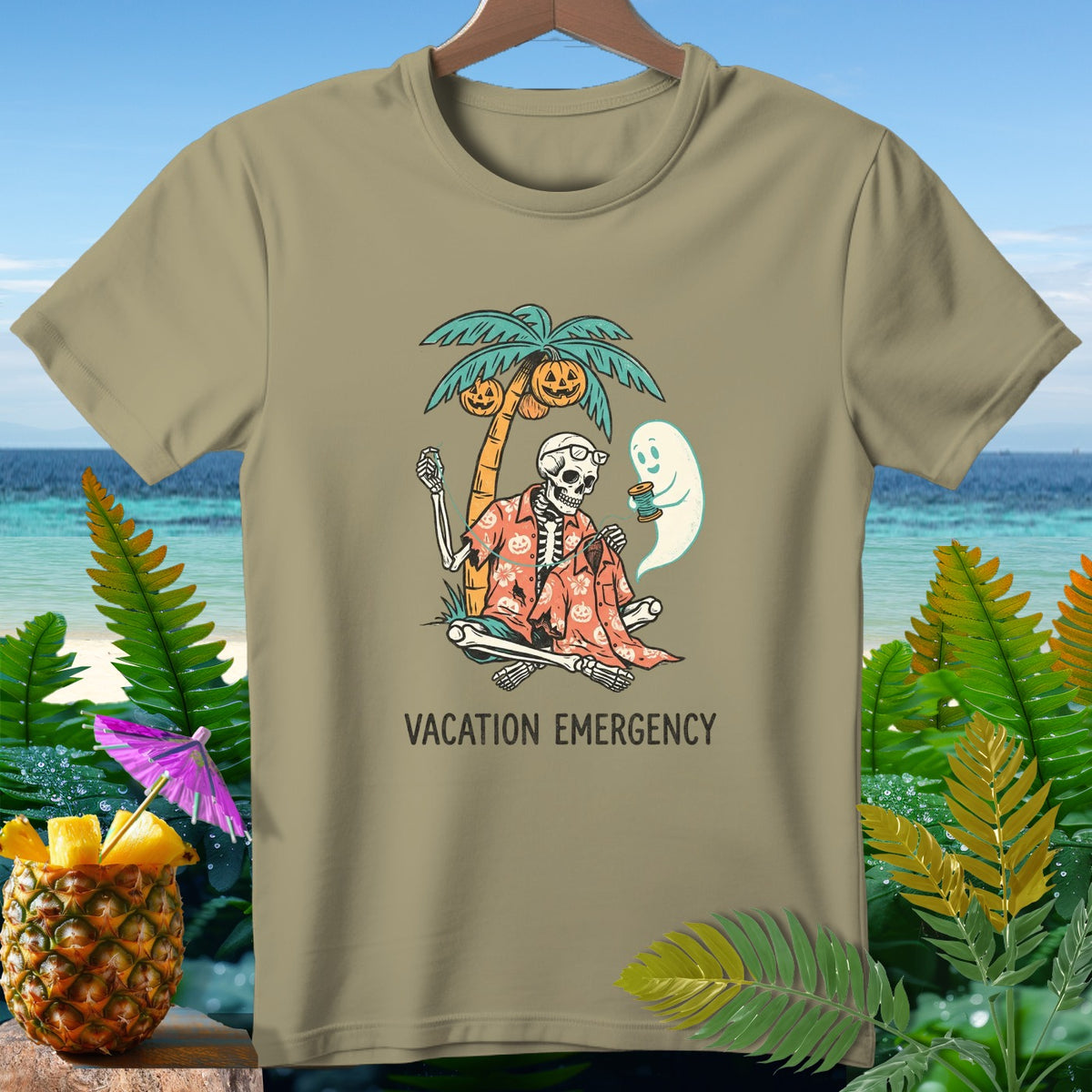 Skeleton on beach under palm tree with pumpkin decorations and ghost, reads "Vacation Emergency."
