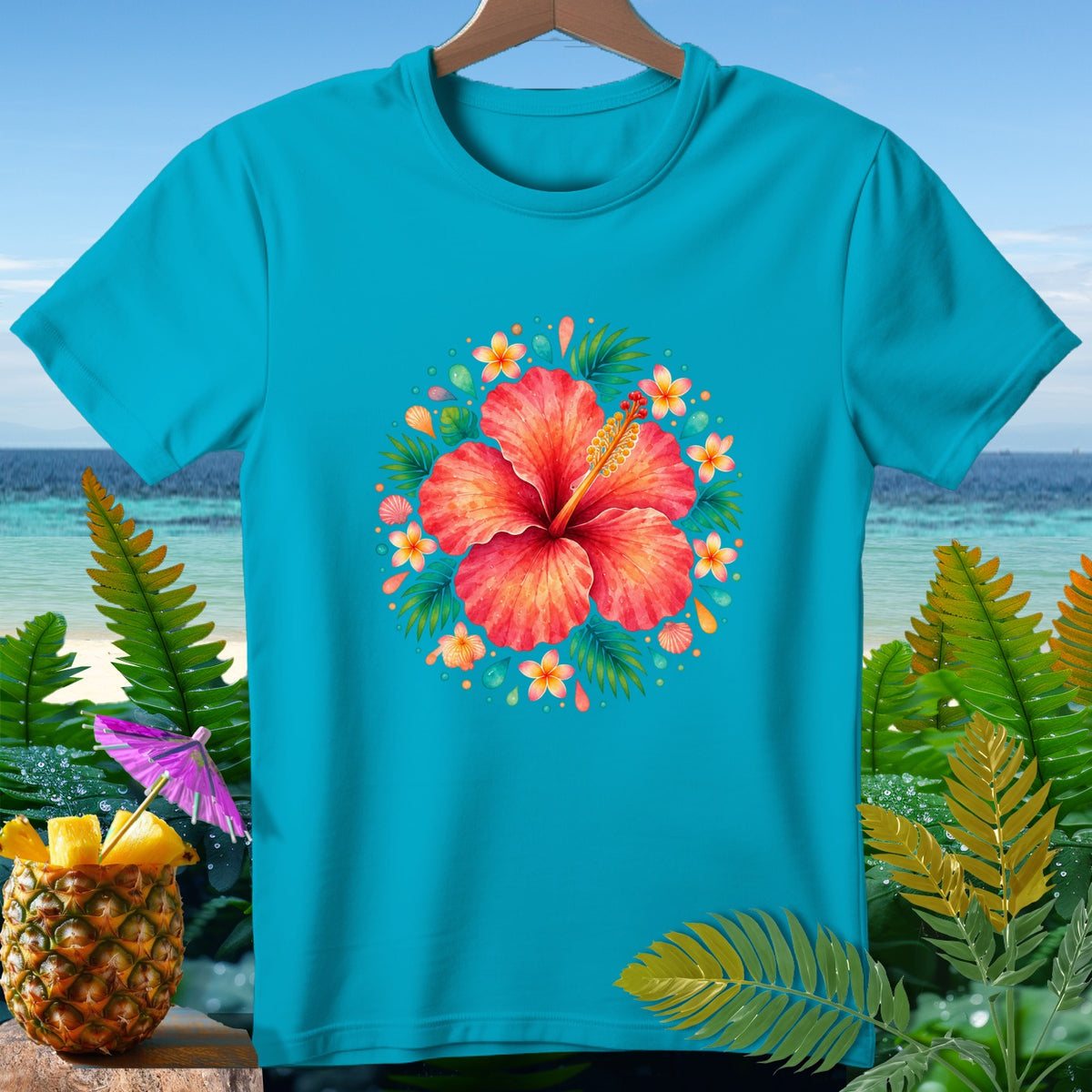 Turquoise t-shirt with a large coral hibiscus flower surrounded by smaller flowers and leaves.