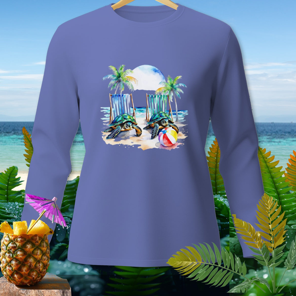 Long sleeve shirt with a watercolor print of two turtles playing with a beach ball.