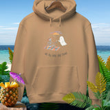 Tan hoodie with skeleton and ghost on a beach blanket, text 