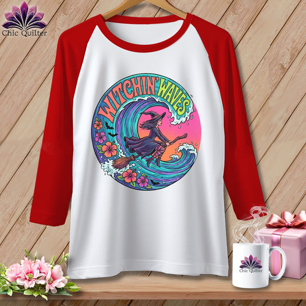 Baseball tee with "Witchin Waves" graphic featuring a witch on a broomstick flying over a wave.