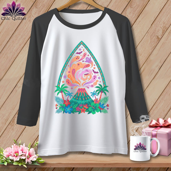 White raglan t-shirt with a colorful volcano, ghosts, bats, and tropical flowers graphic.