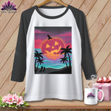 Raglan t-shirt with jack-o'-lantern on beach at sunset graphic.