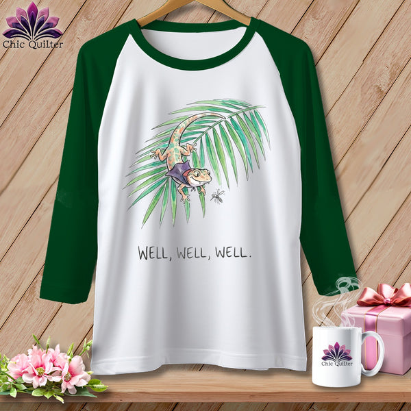 Green and white raglan t-shirt with a gecko, leaf, and text.