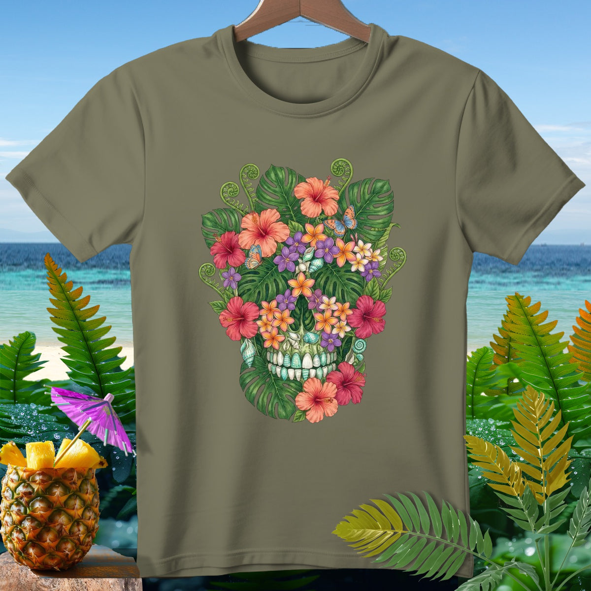 Olive green t-shirt featuring a skull made of tropical flowers, leaves, and butterflies.